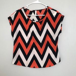Orange, black, and white top!